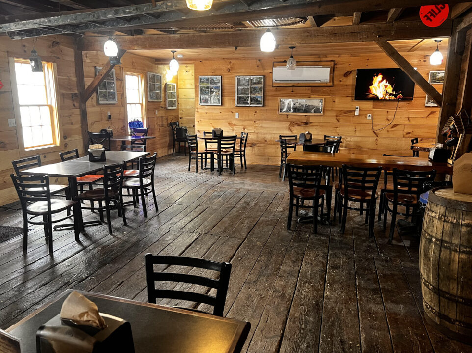 The Woodshed Backroom with tables and chairs